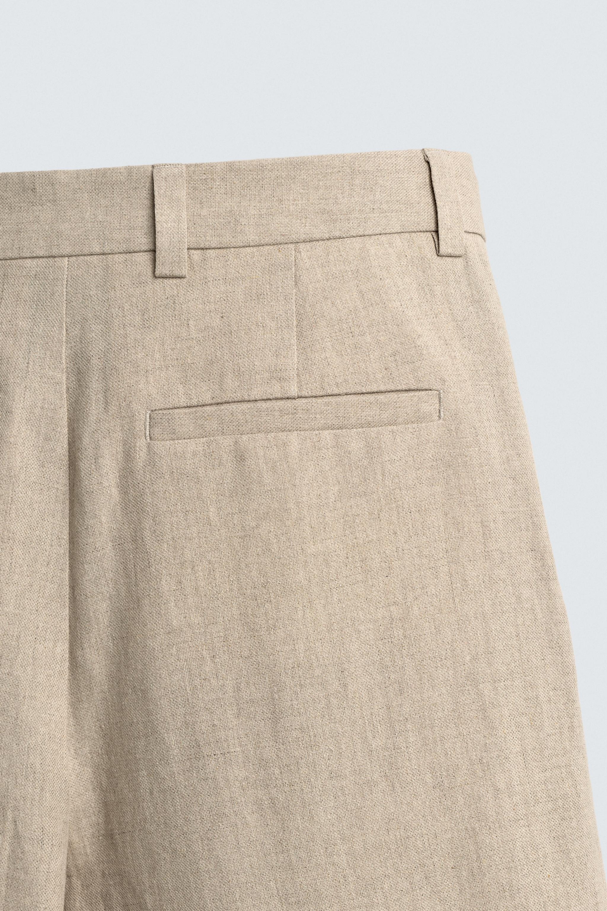 RELAXED FIT PLEATED SUIT PANTS